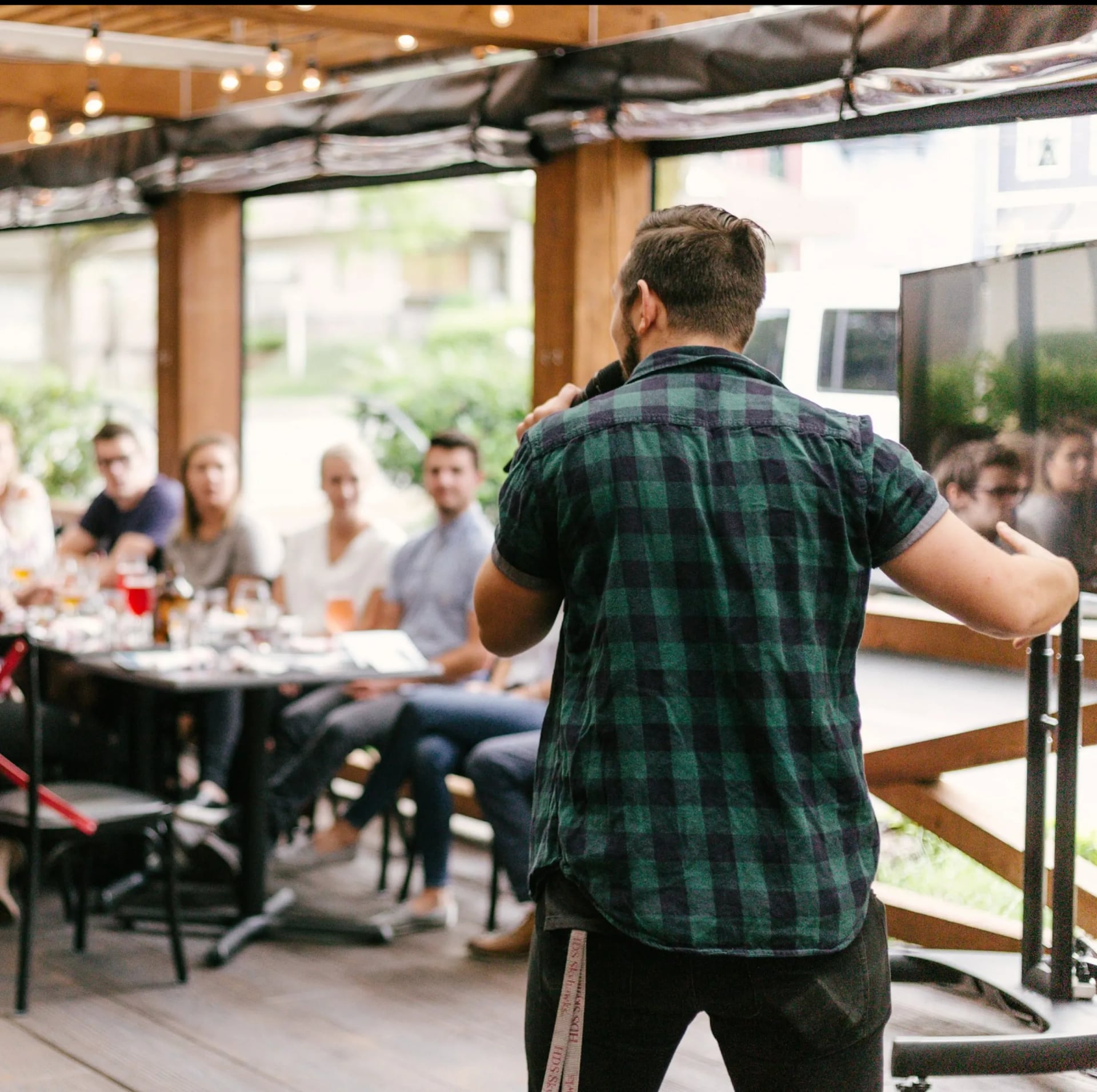 An image showing a singer performing at a live event.